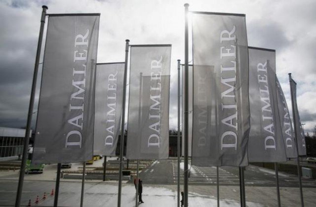 Daimler flags are seen at the annual shareholder meeting in Berlin April 1, 2015. REUTERS/Hannibal Hanschke/Files